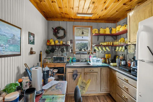 a big house with a big yard and large trees