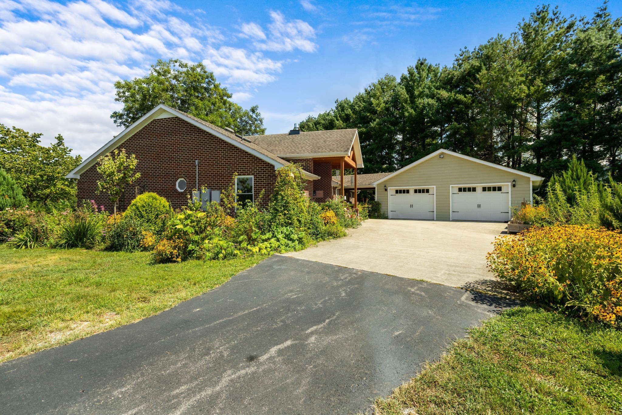 1556 Chestnut Grove Road Morrison, TN 37357 - Photo 40 of 57 a front view of a house with garden