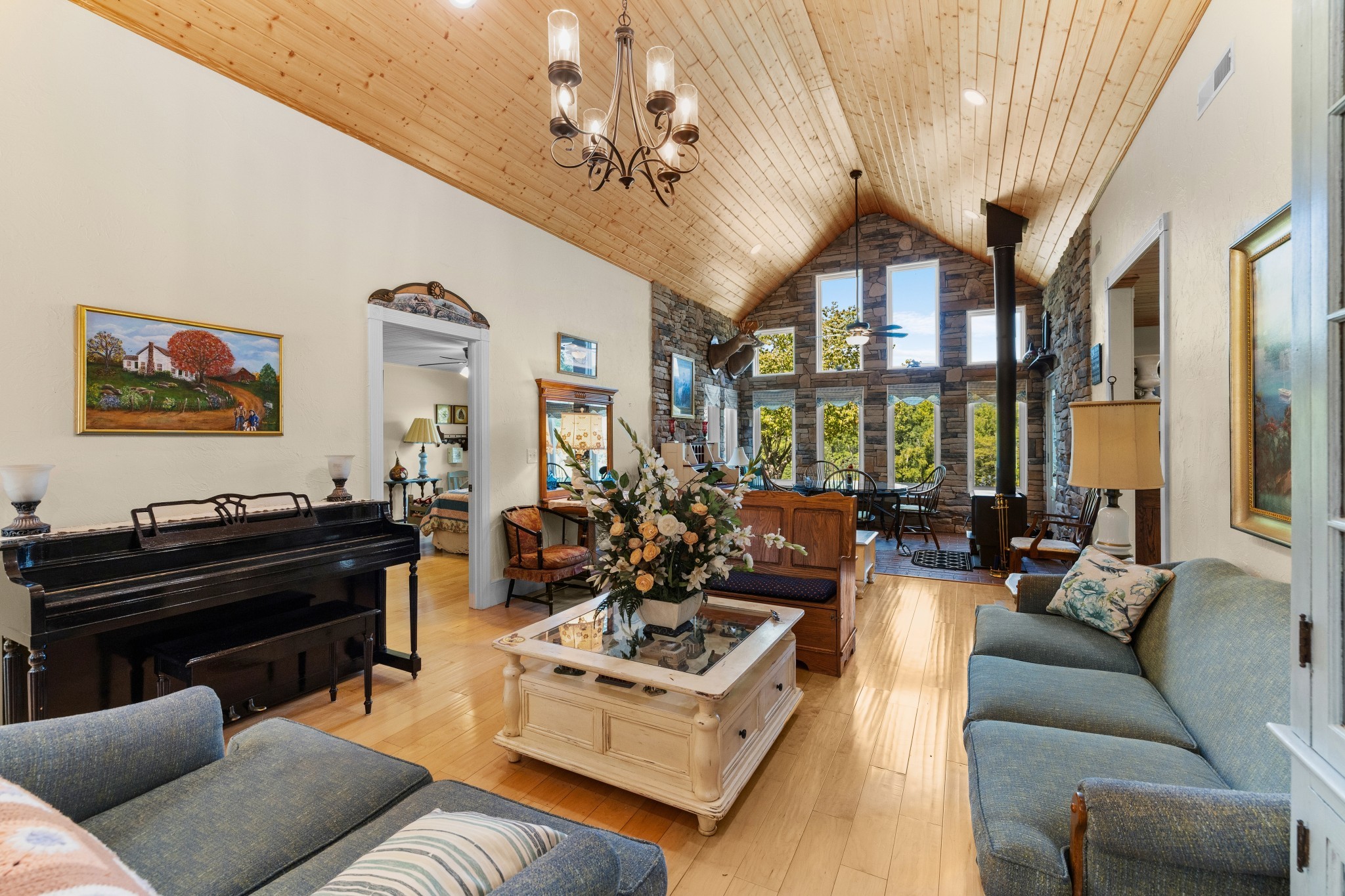 1556 Chestnut Grove Road Morrison, TN 37357 - Photo 8 of 57 a living room with furniture a chandelier and a piano