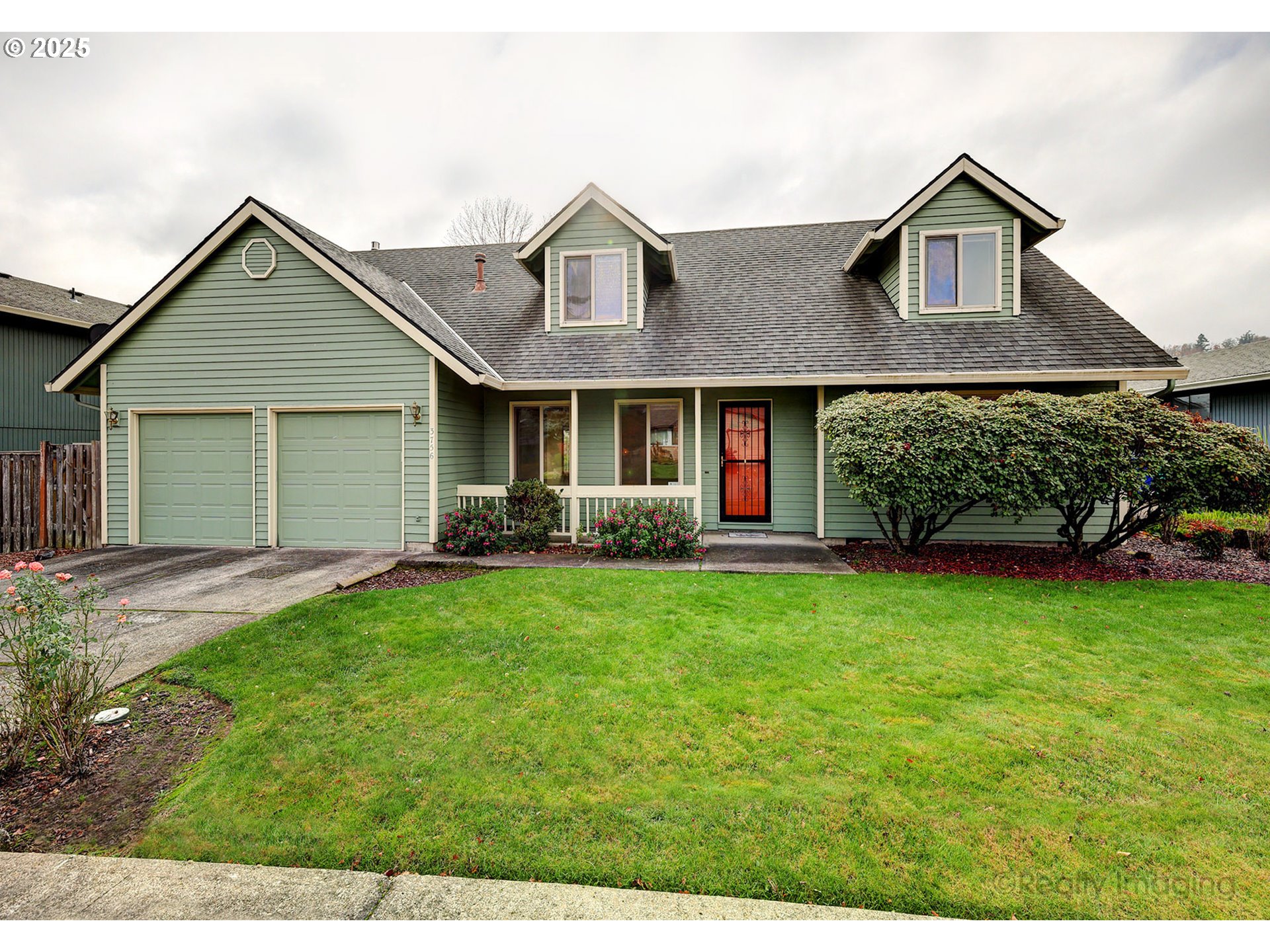 3756 Southwest 7th Court Gresham, OR 97030 - Photo 1 of 29 a front view of a house with a garden