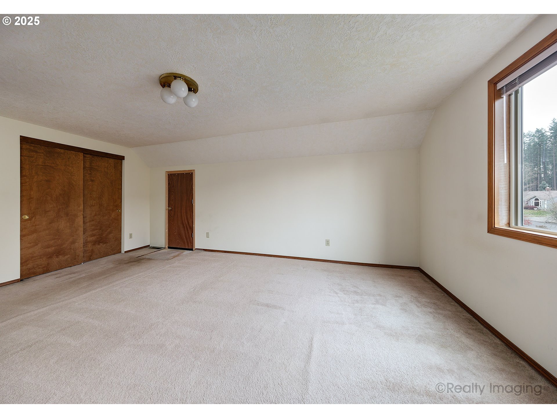 3756 Southwest 7th Court Gresham, OR 97030 - Photo 17 of 29 a view of an empty room with a window
