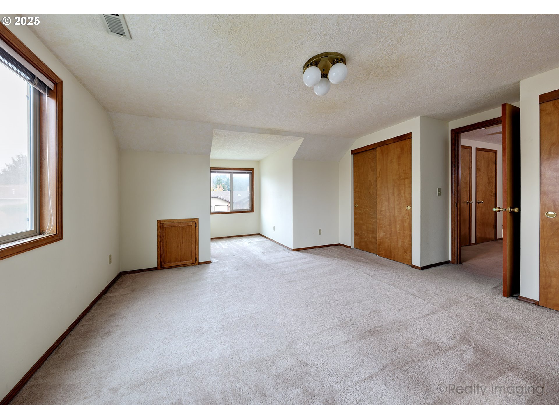 3756 Southwest 7th Court Gresham, OR 97030 - Photo 21 of 29 a view of an empty room with window and cabinet