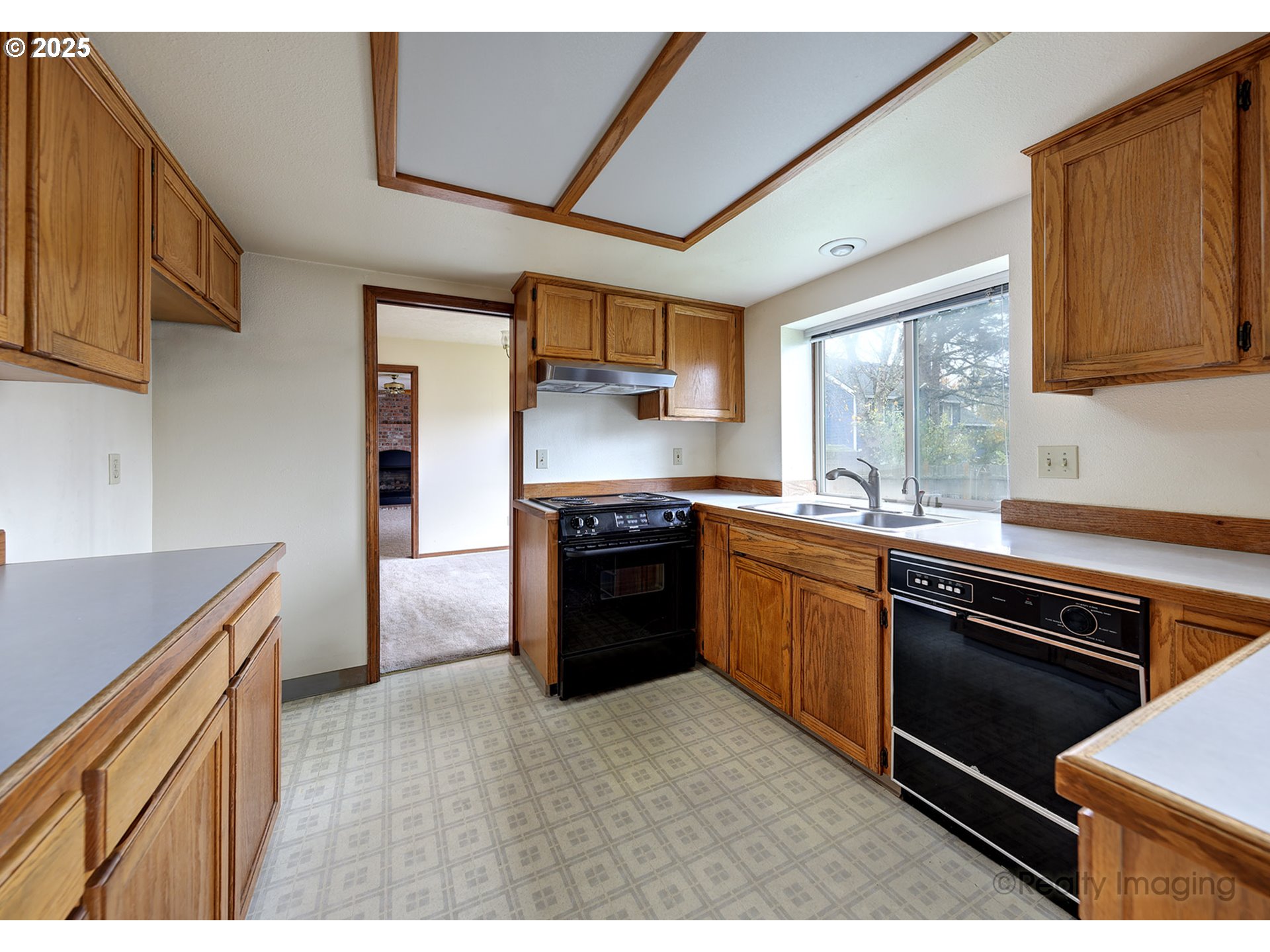3756 Southwest 7th Court Gresham, OR 97030 - Photo 10 of 29 a kitchen with granite countertop stainless steel appliances and wooden cabinets