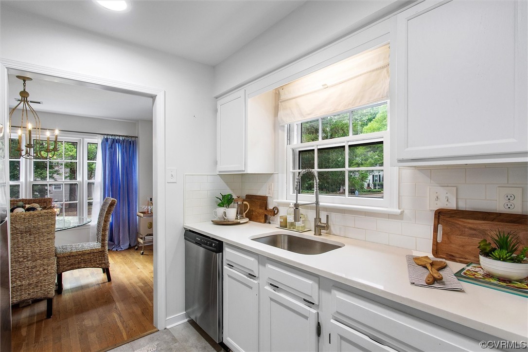 2734 Berkeley Pointe Drive Richmond, VA 23233 - Photo 11 of 31 a kitchen with a sink stove and cabinets