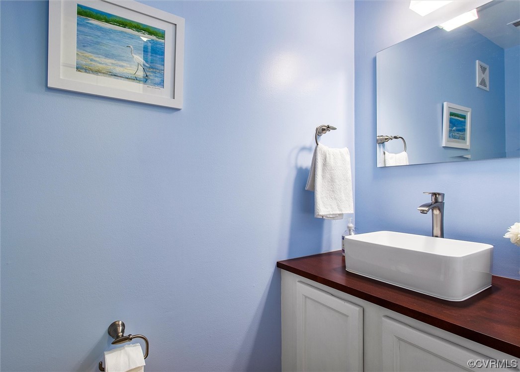 2734 Berkeley Pointe Drive Richmond, VA 23233 - Photo 19 of 31 a bathroom with a sink and a mirror