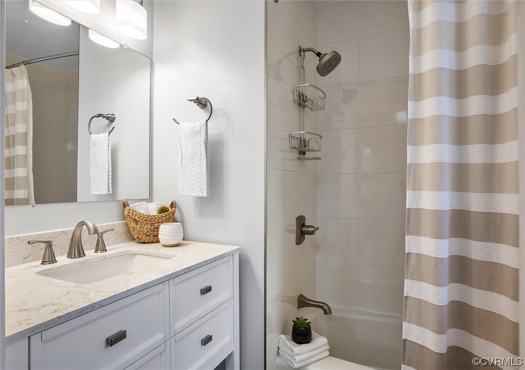 2734 Berkeley Pointe Drive Richmond, VA 23233 - Photo 22 of 31 a bathroom with a granite countertop sink a toilet and shower