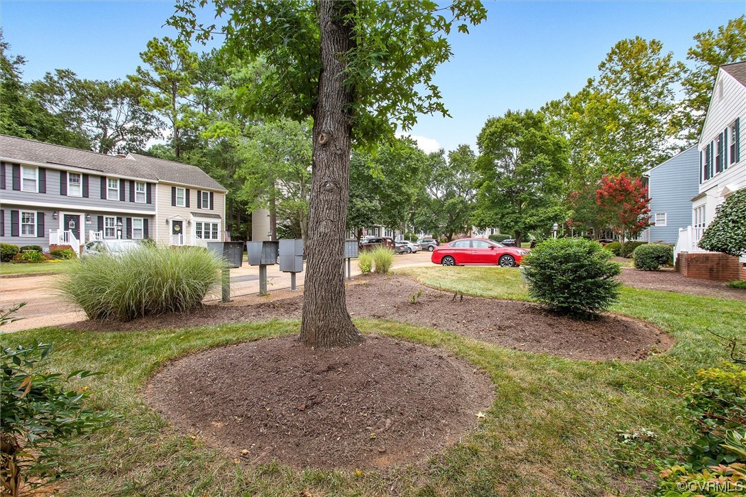 2734 Berkeley Pointe Drive Richmond, VA 23233 - Photo 28 of 31 a front view of a house with a yard and trees