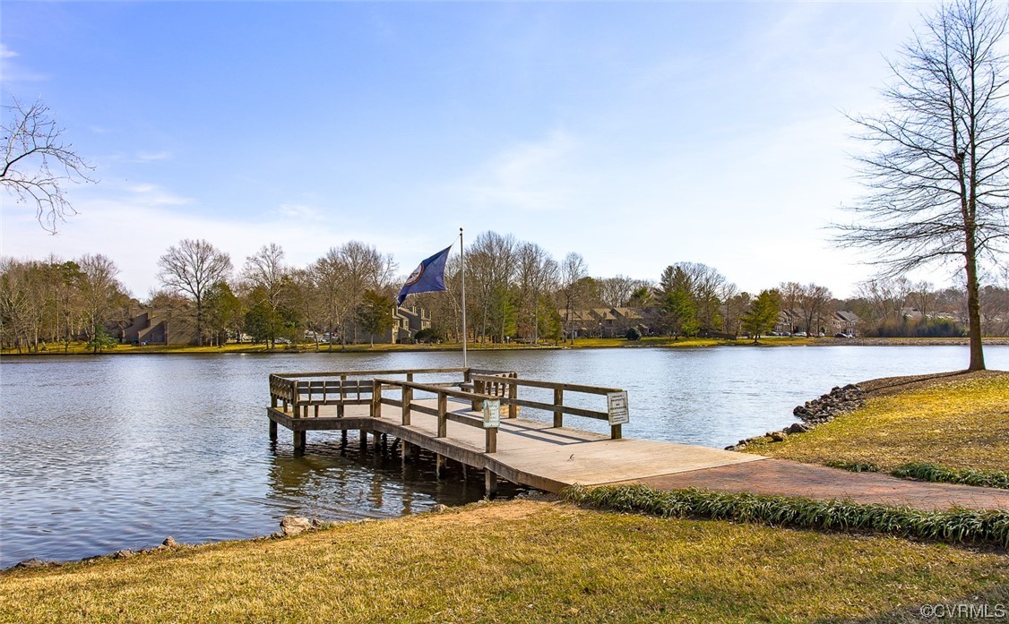 2734 Berkeley Pointe Drive Richmond, VA 23233 - Photo 29 of 31 a view of a lake with houses in the background