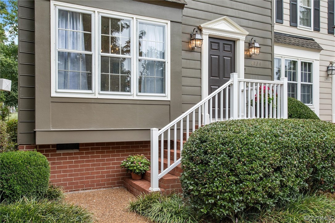2734 Berkeley Pointe Drive Richmond, VA 23233 - Photo 3 of 31 a view of a house with a small deck and a yard