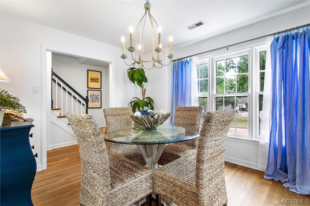 2734 Berkeley Pointe Drive Richmond, VA 23233 - Photo 8 of 31 a dining room with furniture a livingroom and chandelier