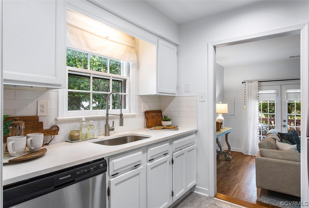 2734 Berkeley Pointe Drive Richmond, VA 23233 - Photo 9 of 31 a kitchen with a sink stove and cabinets