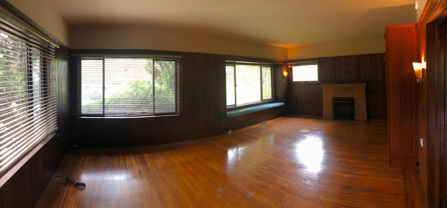 2629 Piedmont Avenue, Unit E Berkeley, CA 94704 - Photo 3 of 14 a view of an empty room with wooden floor and a window