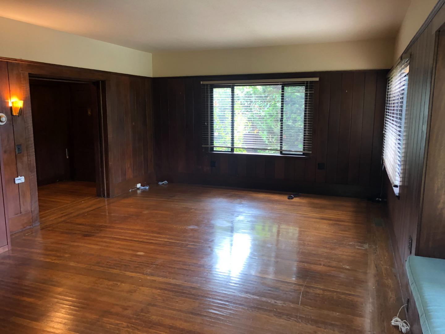 2629 Piedmont Avenue, Unit E Berkeley, CA 94704 - Photo 5 of 14 a view of empty room with wooden floor and fan
