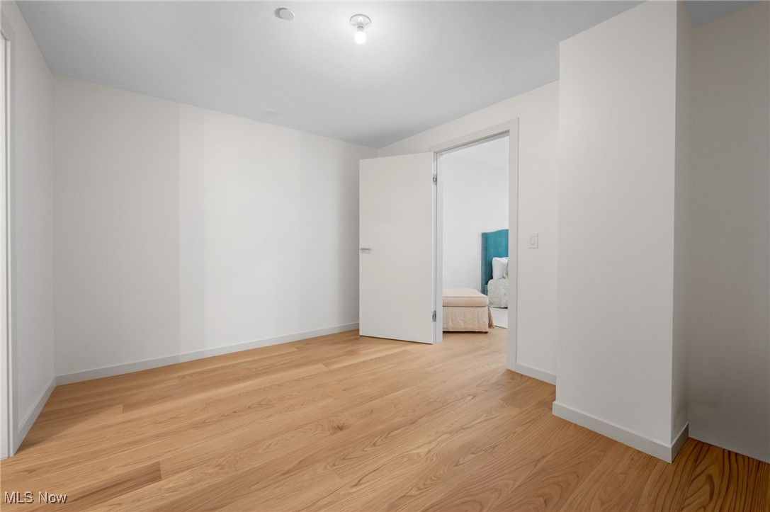 22700 Lake Road, Unit 204 Rocky River, OH 44116 - Photo 15 of 31 Unfurnished room featuring light wood-style floors and baseboards