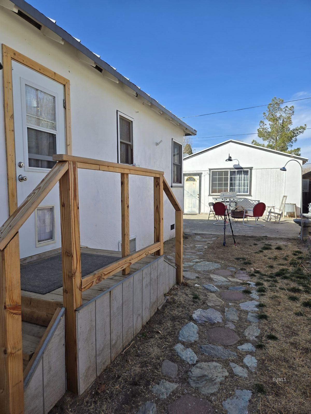 625 East Inyo Street Lone Pine, CA 93545 - Photo 11 of 15 a view of a house with wooden fence