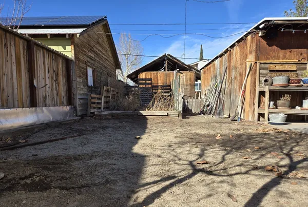 a view of a back yard of the house