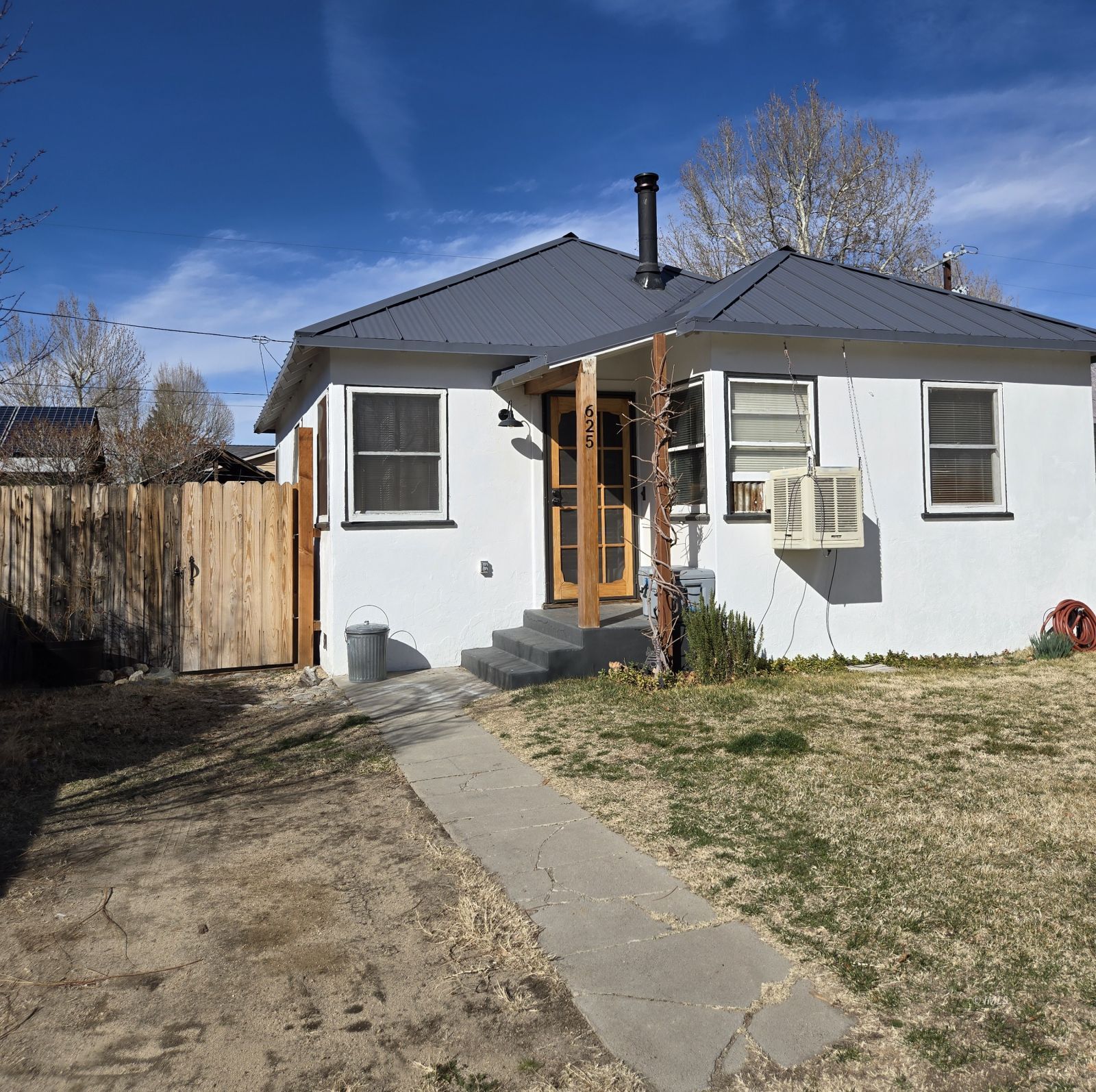 625 East Inyo Street Lone Pine, CA 93545 - Photo 15 of 15 a front view of a house with a yard