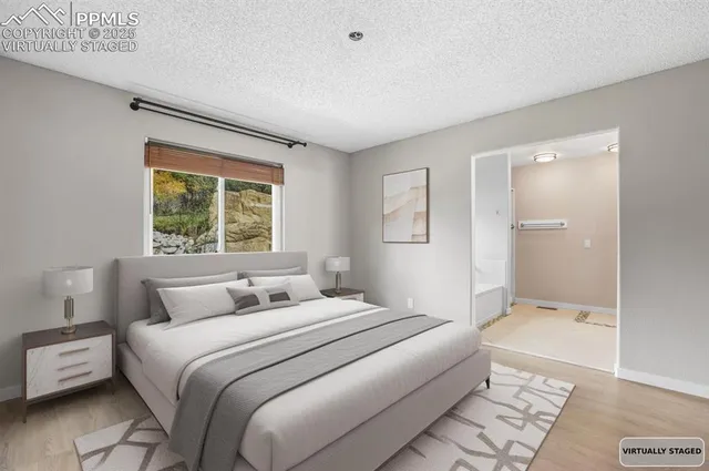 a bedroom with a large bed and a window