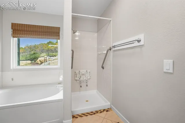 a bathroom with a bathtub and a shower