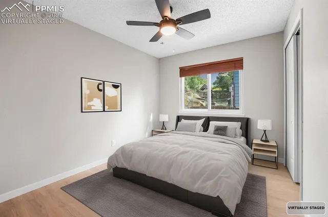 a bedroom with a large bed and a window