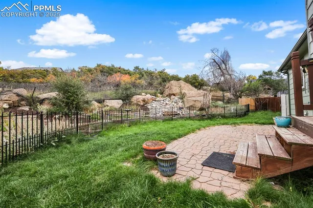 a view of a yard with furniture