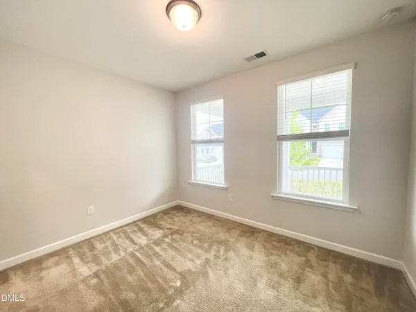 an empty room with a natural light