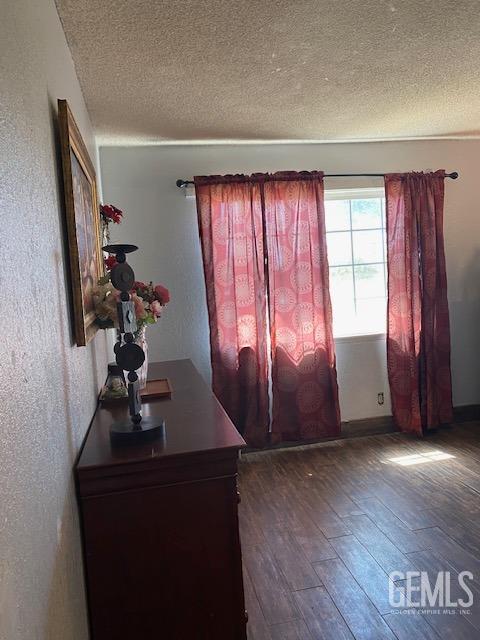 Undisclosed Address Bakersfield, CA 93307 - Photo 2 of 9 wooden floor in an empty room with a window