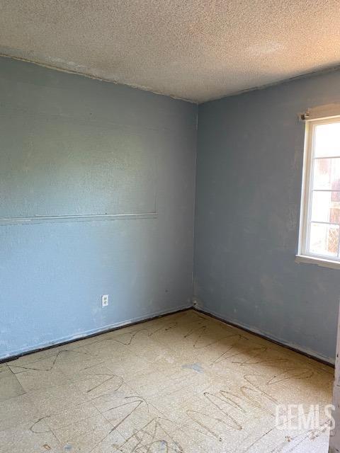 Undisclosed Address Bakersfield, CA 93307 - Photo 3 of 9 an empty room with a window