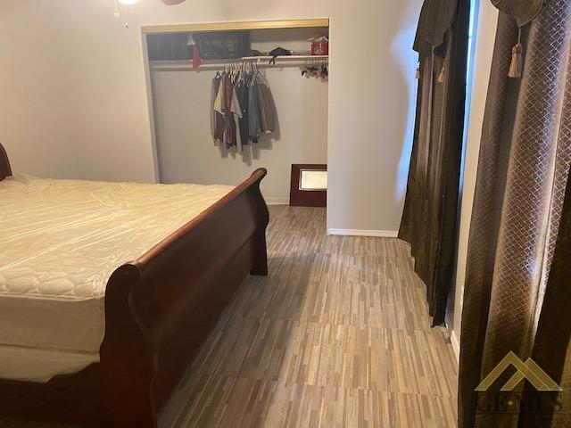 Undisclosed Address Bakersfield, CA 93307 - Photo 7 of 9 a view of walk in closet with clothes and shoes