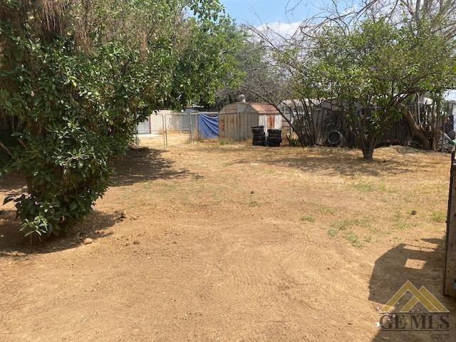 Undisclosed Address Bakersfield, CA 93307 - Photo 8 of 9 a view of a yard with trees