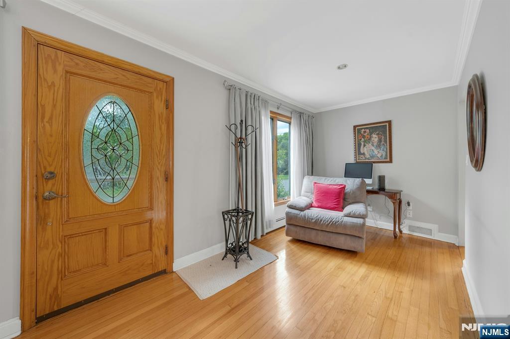 24 Cambridge Road Tenafly, NJ 07670 - Photo 5 of 31 a living room with furniture and a wooden floor