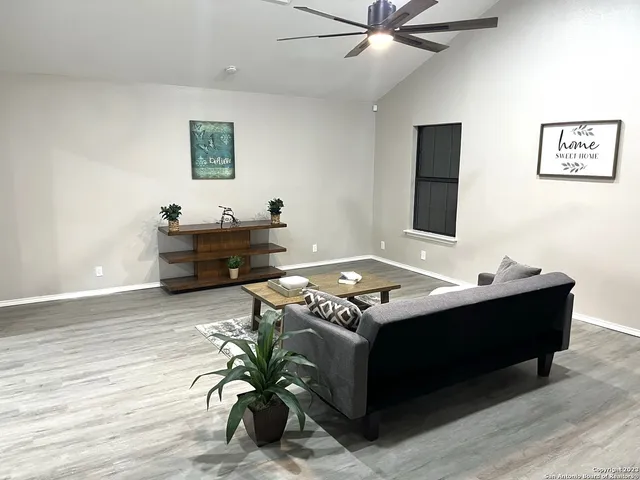 a living room with furniture and a table