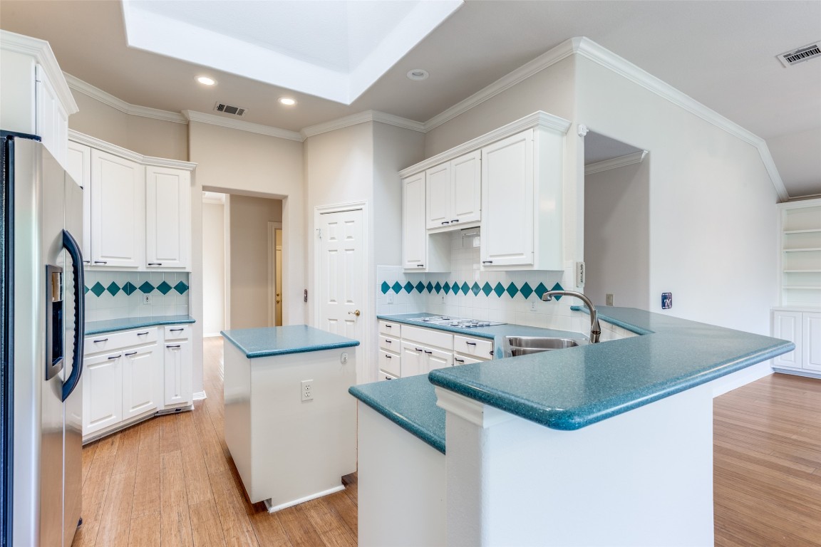 6901 Bright Star Lane Austin, TX 78736 - Photo 11 of 24 a kitchen with stainless steel appliances granite countertop a sink and a refrigerator