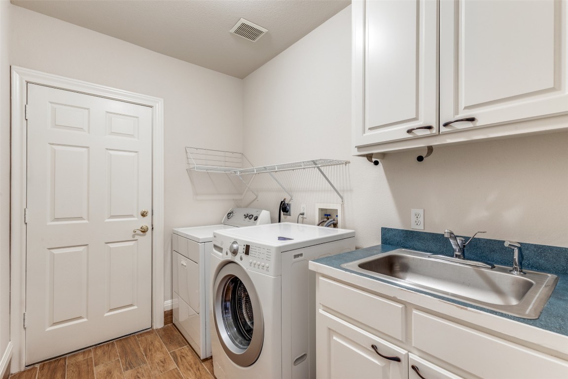 6901 Bright Star Lane Austin, TX 78736 - Photo 12 of 24 a utility room with dryer and washer