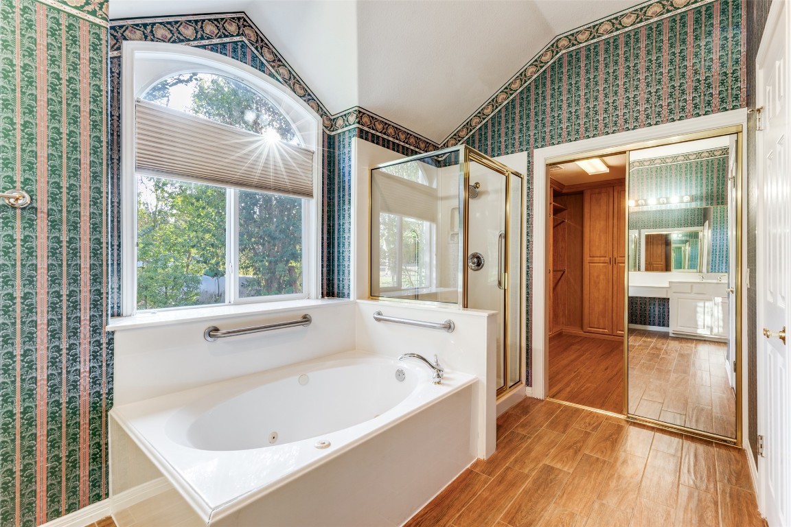 6901 Bright Star Lane Austin, TX 78736 - Photo 18 of 24 a bathroom with a bathtub and a shower