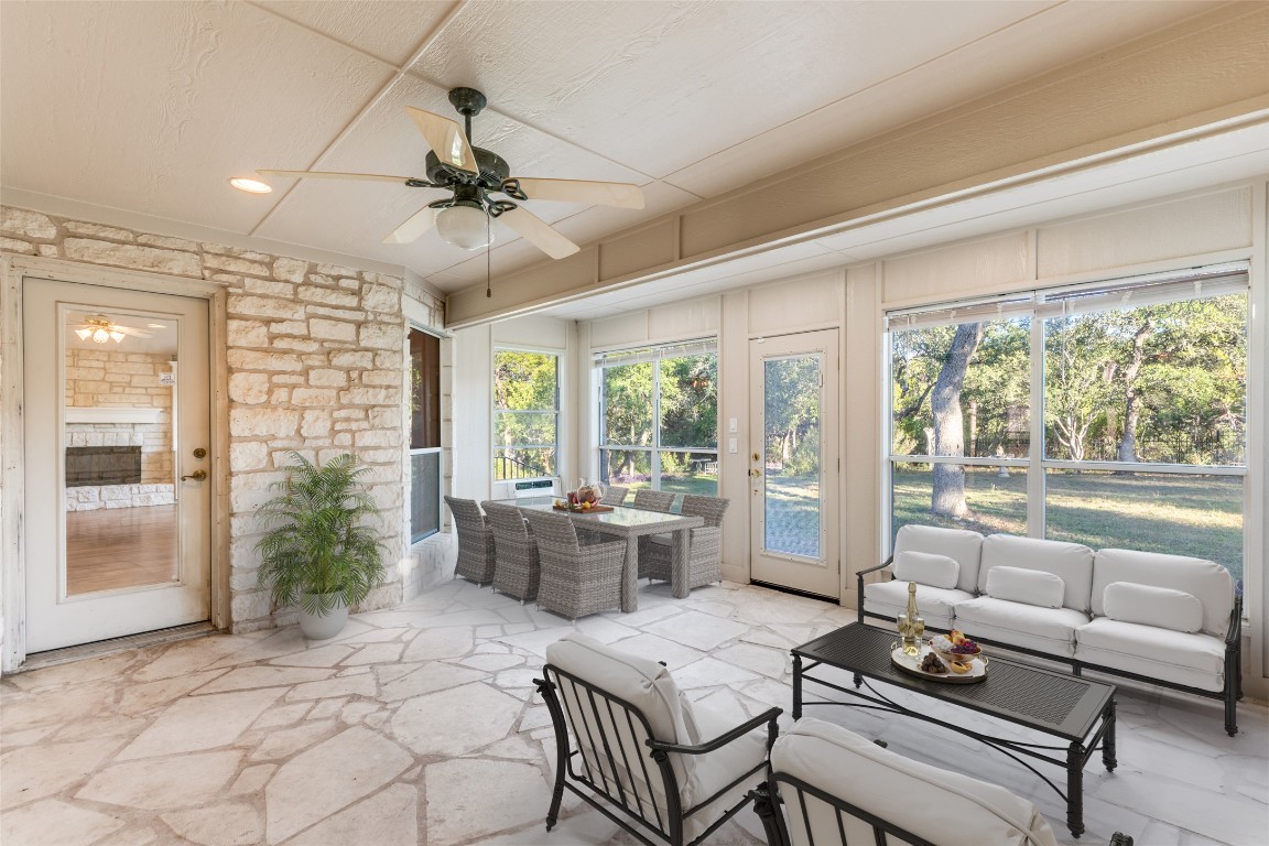 6901 Bright Star Lane Austin, TX 78736 - Photo 22 of 24 a living room with furniture and a large window