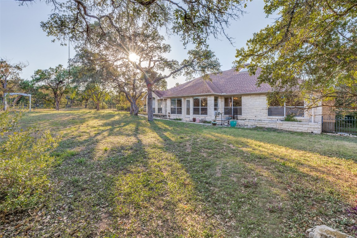 6901 Bright Star Lane Austin, TX 78736 - Photo 23 of 24 a front view of a house with a garden