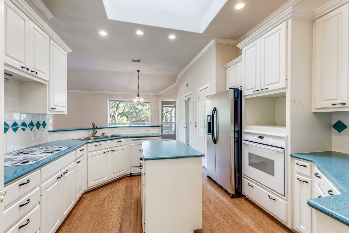 6901 Bright Star Lane Austin, TX 78736 - Photo 10 of 24 a kitchen with granite countertop appliances cabinets and a counter space