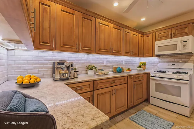 a kitchen with stainless steel appliances granite countertop a sink and cabinets