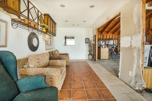 a living room with furniture and a clock
