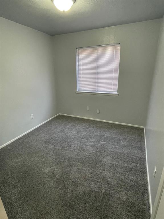 738 East Oates Road Garland, TX 75043 - Photo 7 of 19 an empty room with a window