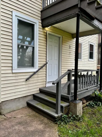 a view of a house with porch and wooden floor