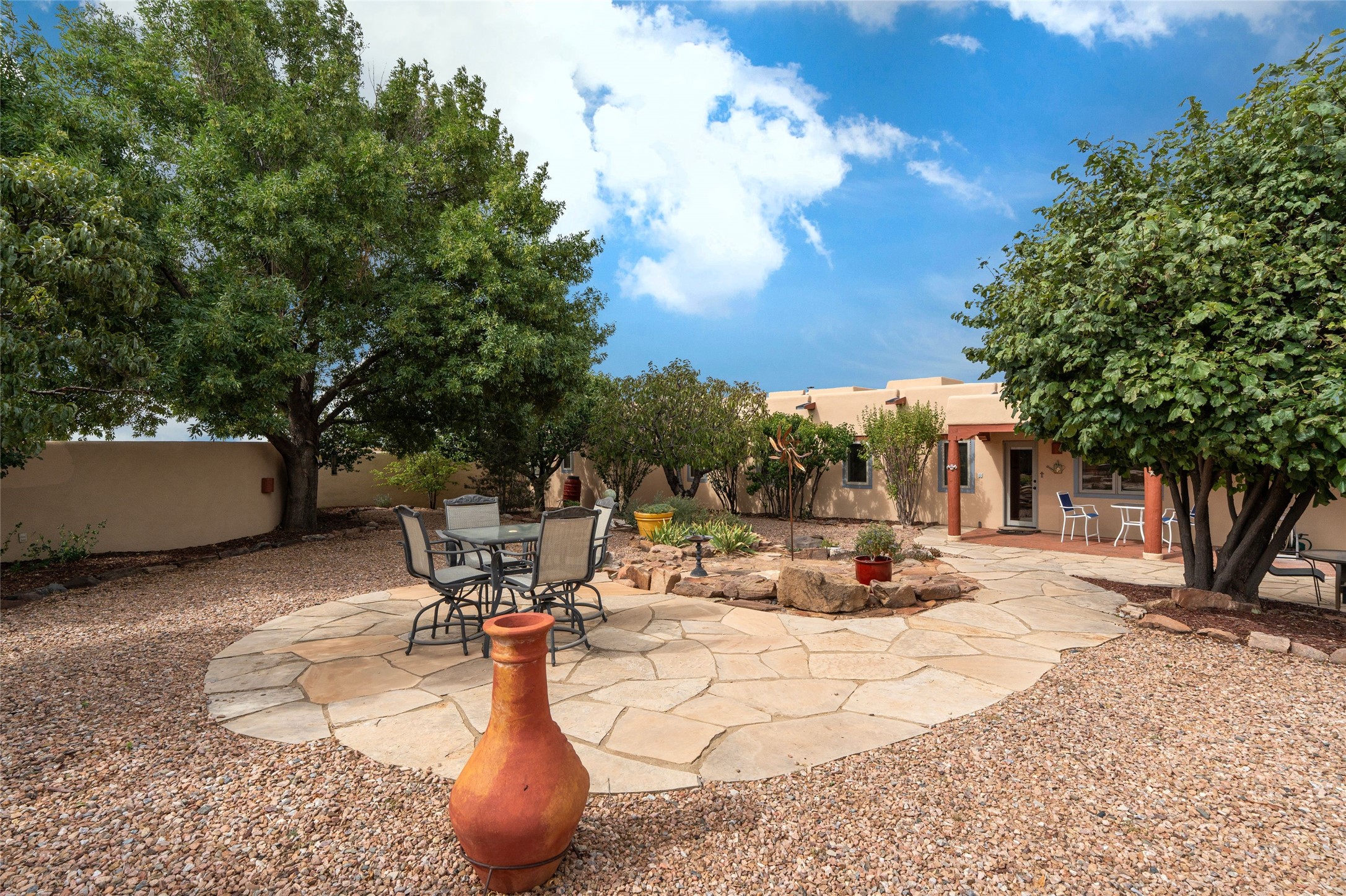 23 Descanso Road Santa Fe, NM 87508 - Photo 17 of 54 Fully enclosed, terraced backyard with mature trees
