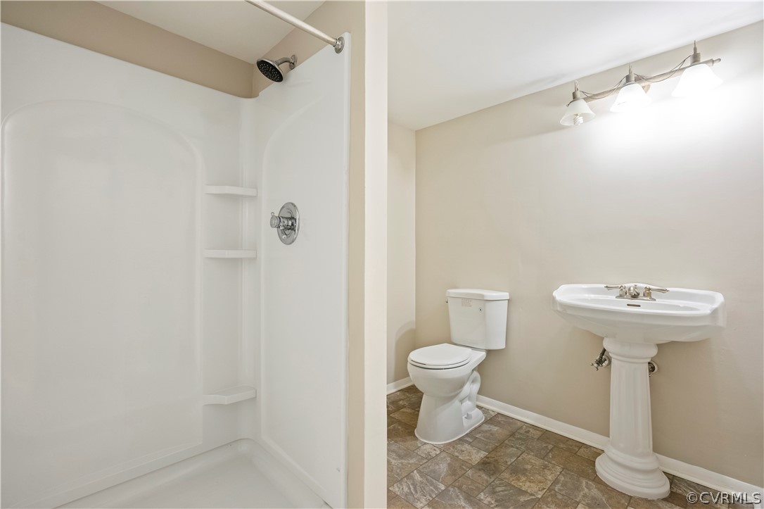 4201 Wistar Road Henrico, VA 23228 - Photo 16 of 30 a bathroom with a sink toilet and shower