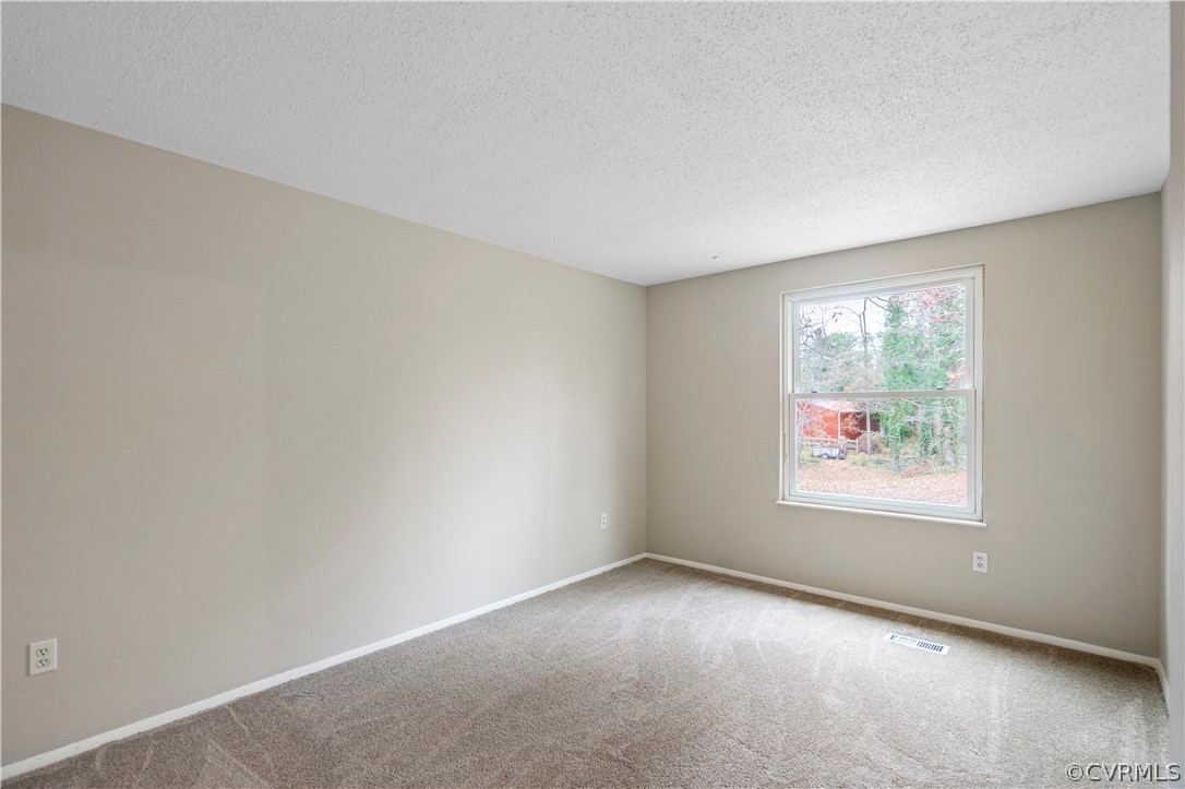 4201 Wistar Road Henrico, VA 23228 - Photo 17 of 30 an empty room with windows