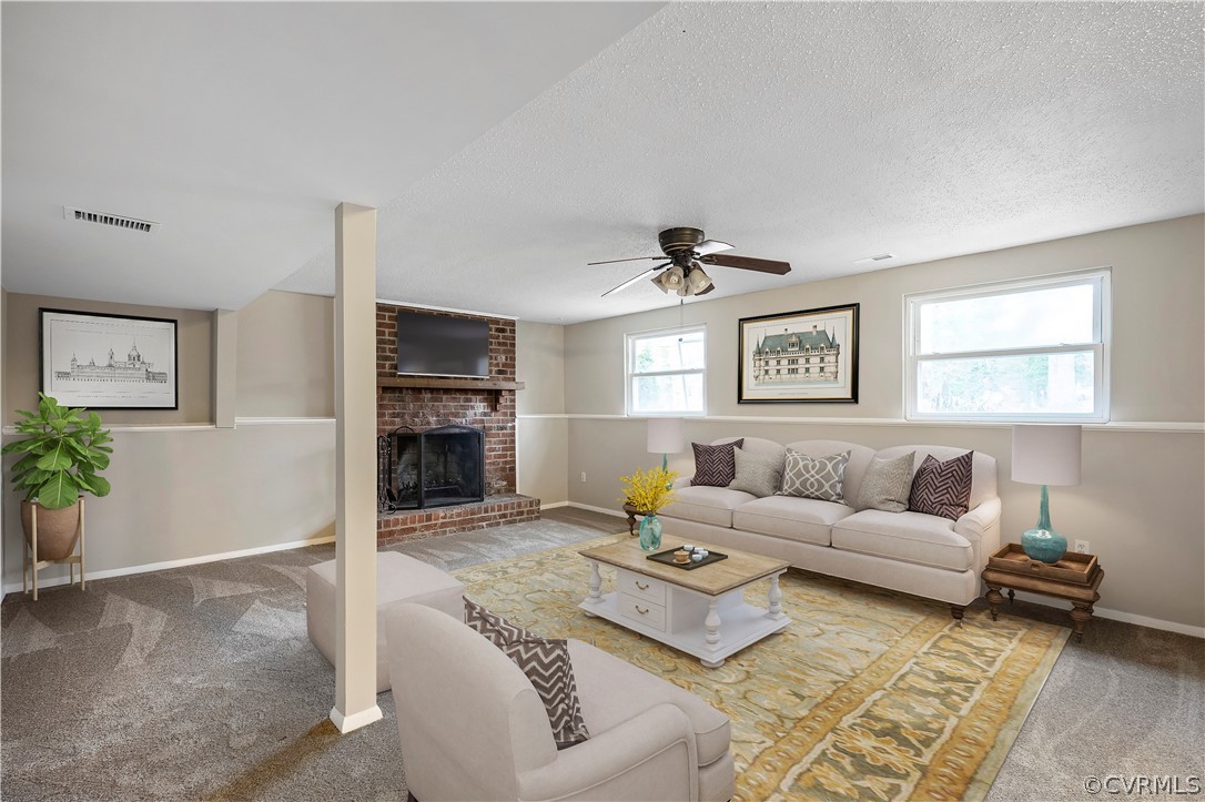4201 Wistar Road Henrico, VA 23228 - Photo 4 of 30 a living room with furniture and a fireplace