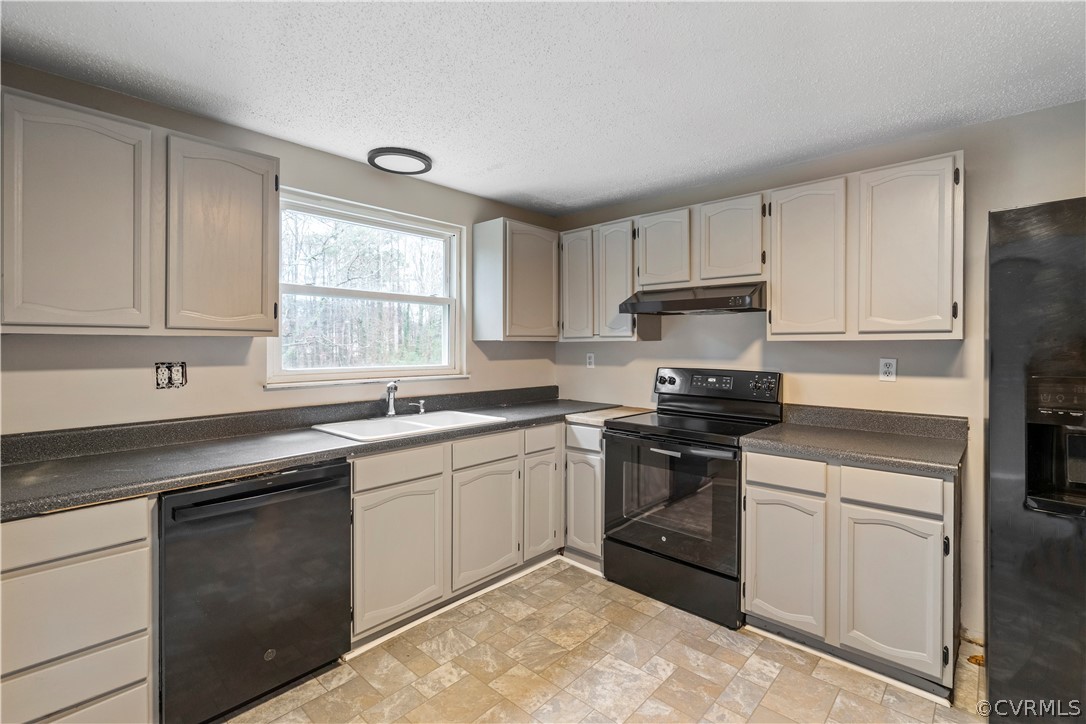 4201 Wistar Road Henrico, VA 23228 - Photo 9 of 30 a kitchen with a sink stove and microwave