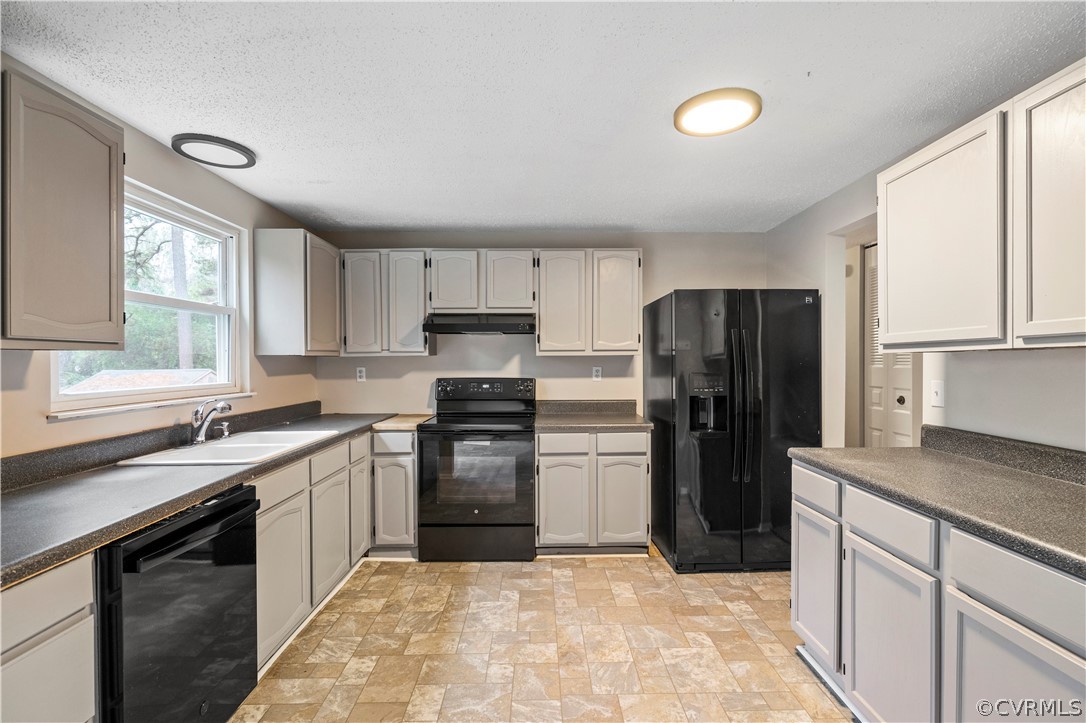 4201 Wistar Road Henrico, VA 23228 - Photo 10 of 30 a kitchen with a sink stove and refrigerator