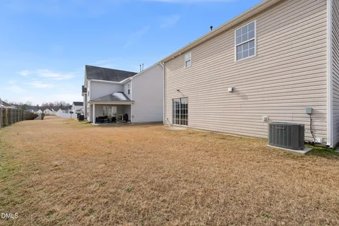 a house view with a backyard space