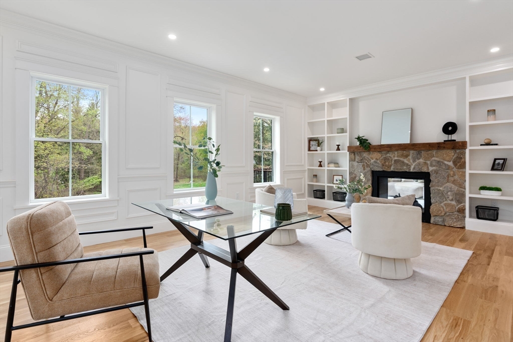 82 Deer Path Lane Weston, MA 02493 - Photo 13 of 42 a living room with furniture and a fireplace